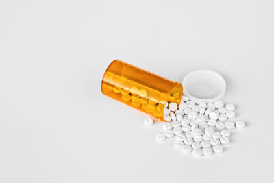 High angle view of bottles on white background