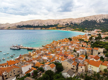 High angle view of townscape by sea