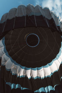 Low angle view of lanterns hanging against sky
