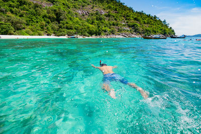 Man swimming in sea