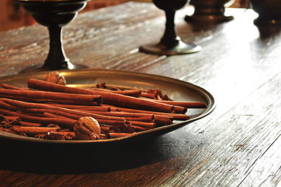 Close-up of cinnamon sticks in plate