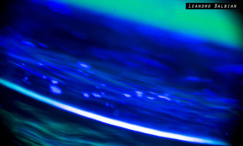 Close-up of illuminated water against sky