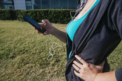 Girl exercising with mobile phone