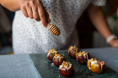 Midsection of man preparing food on table