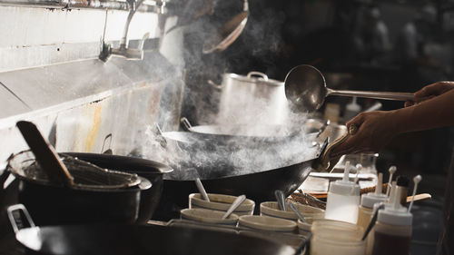 Chef stir fry busy cooking in kitchen. chef stir fry the food in a frying pan, 