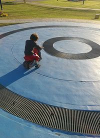 High angle view of boy in shopping cart