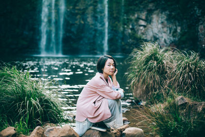 Woman sitting in a forest