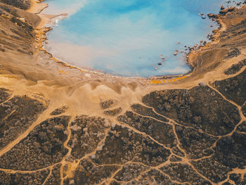 Aerial view of arid landscape against sky