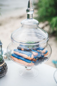 Close-up of sausages and blackberries in container on table