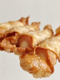 Close-up of burger against white background