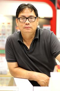 Close-up portrait of a young man wearing eyeglasses