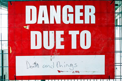 Close-up of warning sign on wall