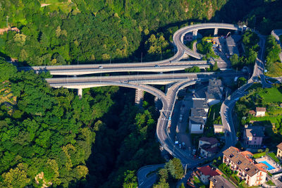 High angle view of road amidst trees in city