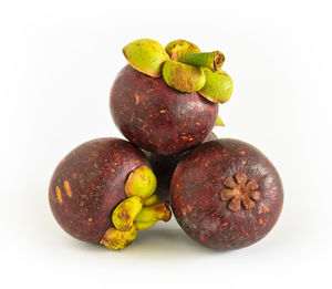 Close-up of fruits against white background