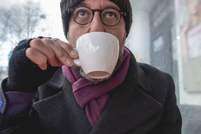 Portrait of mid adult man holding ice cream