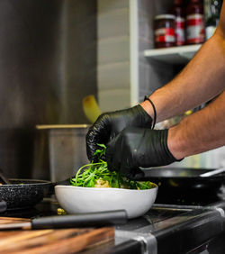 Midsection of man preparing food at home