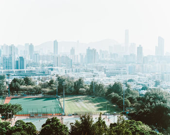 High angle view of cityscape against sky on sunny day