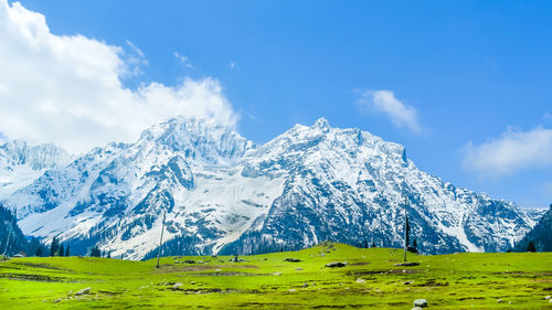 Scenic view of snowcapped mountains against sky