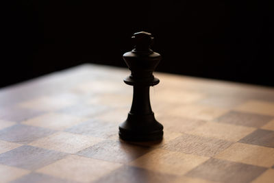 Close-up of chess pieces on floor