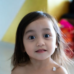 Portrait of an asian toddler, 3 years old. cheeerful, joyful and full of confidence.