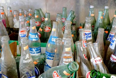 High angle view of various bottles on display