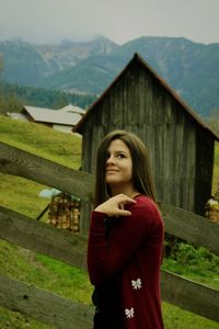 Beautiful young woman standing on mountain