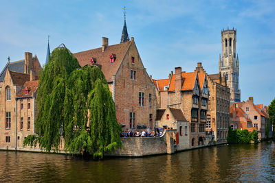 Panoramic view of river amidst buildings against sky