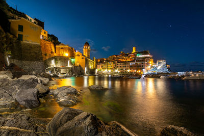 Illuminated buildings in city at night