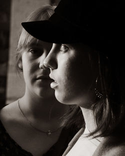 Close-up portrait of young woman looking away