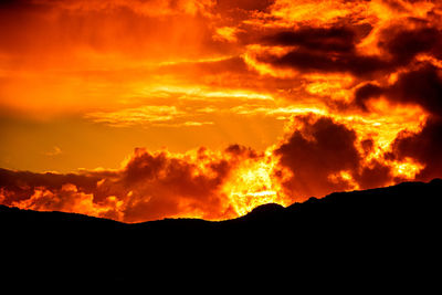 Low angle view of dramatic sky during sunset