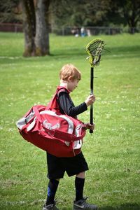 Boy standing on grass