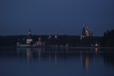 Reflection of building in lake at night