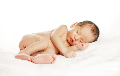 Cute baby sleeping on bed
