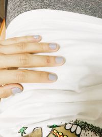 High angle view of hands on table