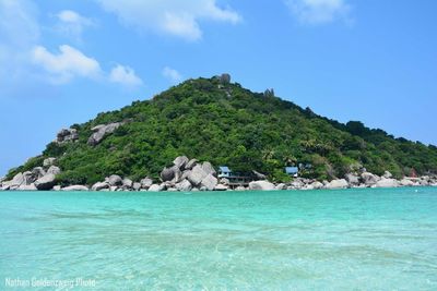 Scenic view of sea against blue sky