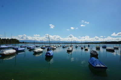 Boats moored at harbor