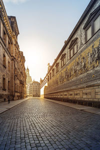 Street amidst buildings against sky