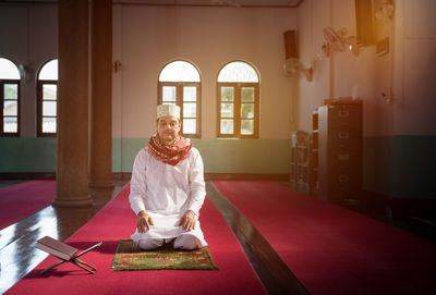 Man praying at mosque