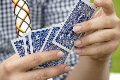 Close-up of man holding hands