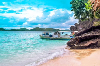 Scenic view of sea against cloudy sky