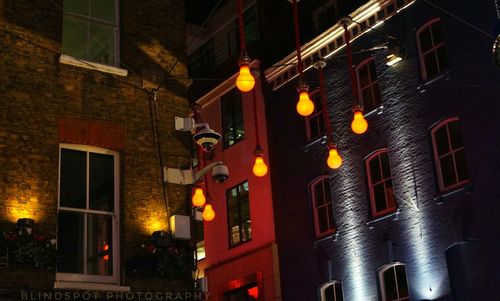 Low angle view of illuminated building at night