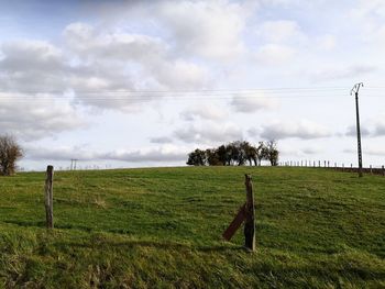 Scenic view of field seen through fence