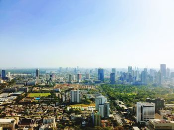 High angle view of buildings in city against clear sky