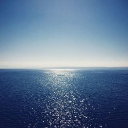 Scenic view of sea against blue sky