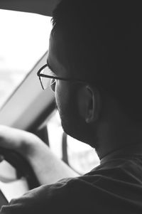 Close-up of man in car