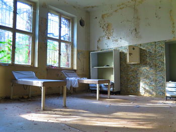 Empty old beds in abandoned room