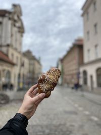 Cropped hand holding food