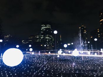 Illuminated buildings in city at night