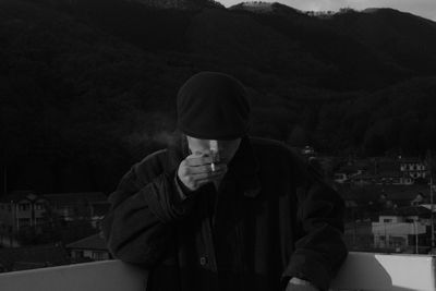 Portrait of a young man drinking glass