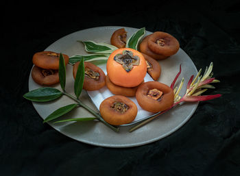 High angle view of fruits in plate on table